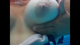 BBW DD tits float in an obstacle pool